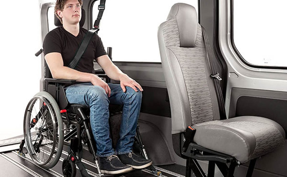 A combined occupant belt and wheelchair tie-down system that mounts in the rails of an Innotrax floor and a Surface rail on the vehicle side.